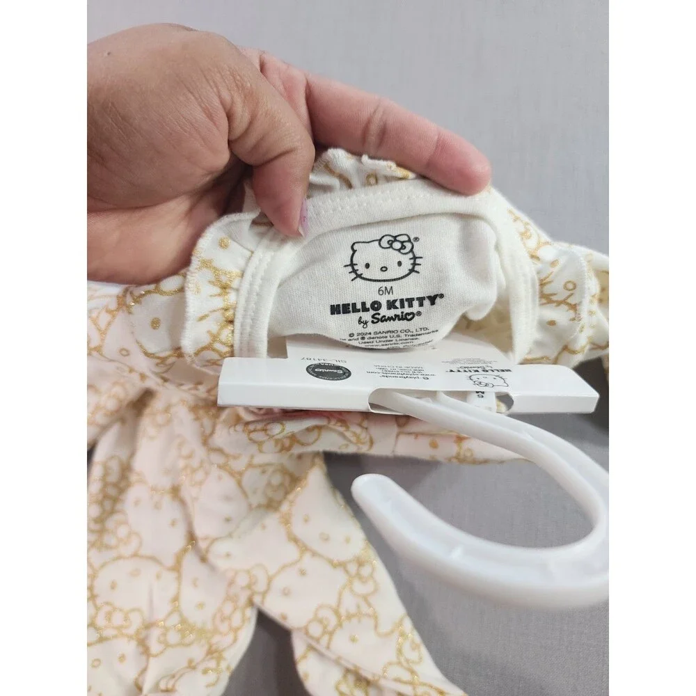 Hello Kitty Baby Girl Footed Sleeper White & Gold Ruffle Zip-Up One-Piece...